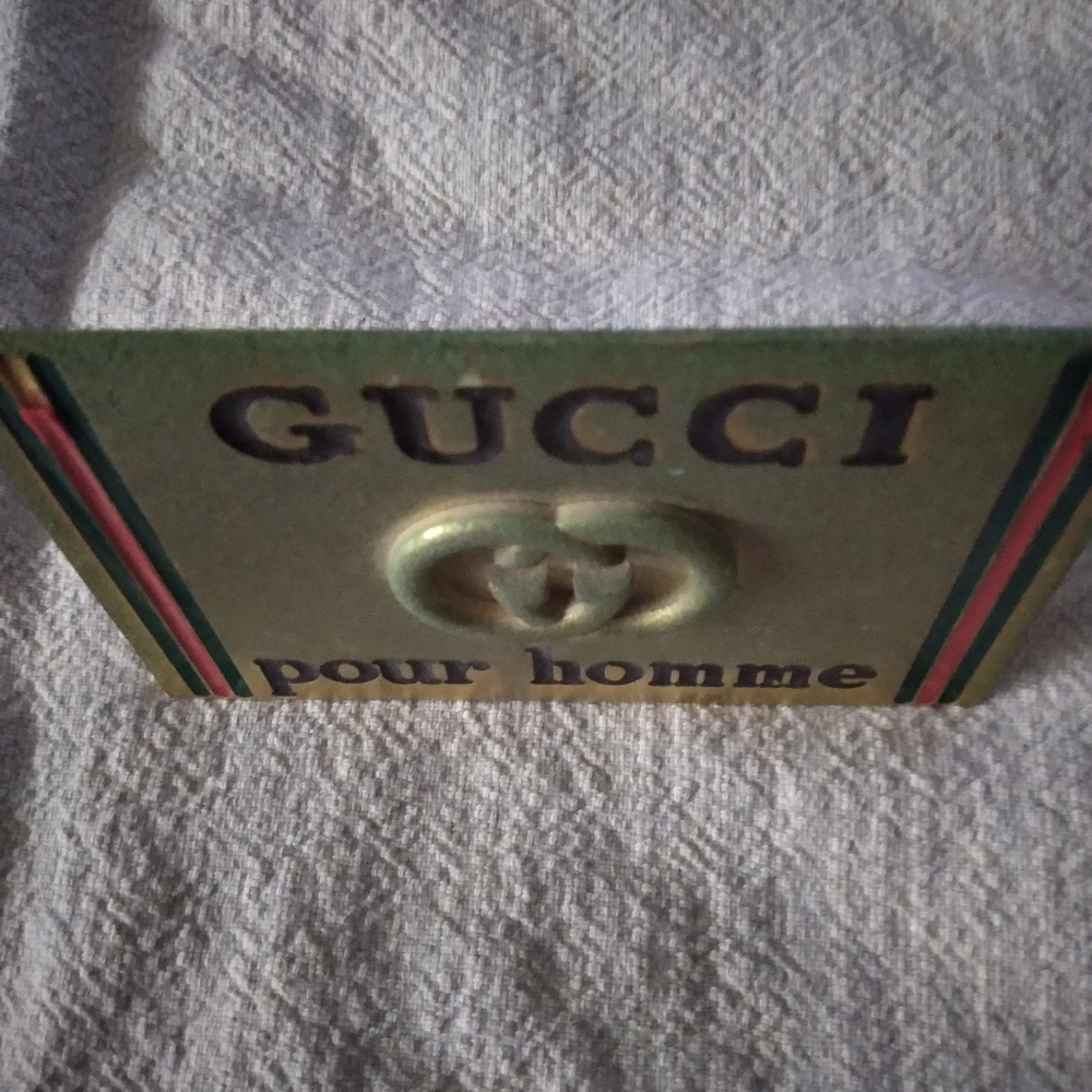 Gold brass gucci artifact.